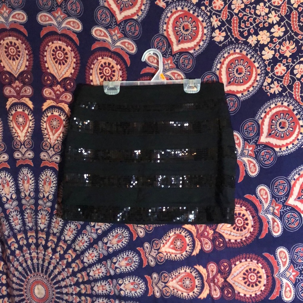 Very cute black skirt with black sequins.